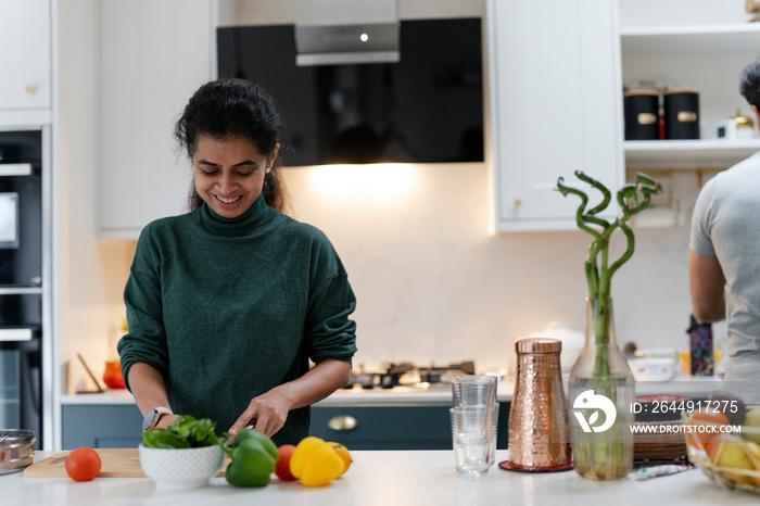 Woman preparing food in kitchen