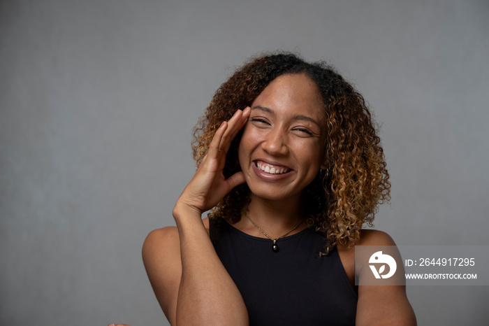 Portrait of smiling woman with curly hair