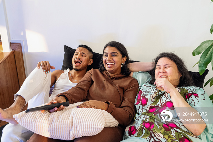 Friends eating ice cream and watching tv