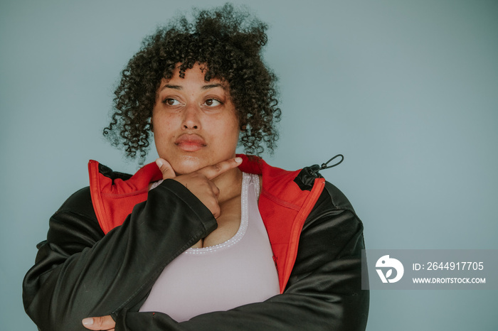 portrait of a plus size afro indigenous person looking away