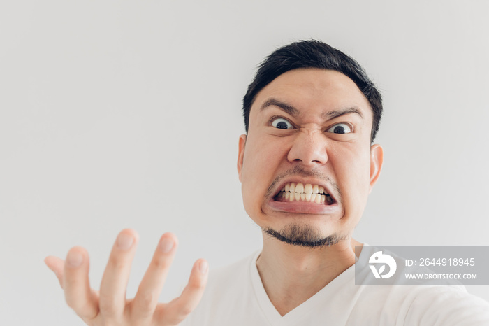 Close up face of angry man selfie himself.