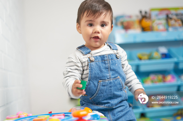 baby playing in house