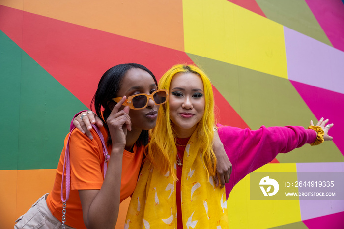 Portrait of young female friends outdoors