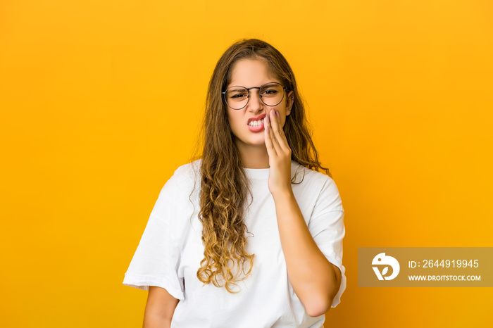 Young caucasian woman having a strong teeth pain, molar ache.