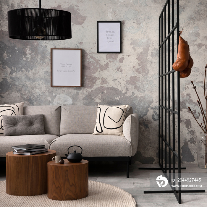 Sophisticated composition of modern living room with design sofa, lamp, carpet, clothes rack , decoration and personal accessories. Wabi sabi concrete wall. Minimalist home decor. Template.