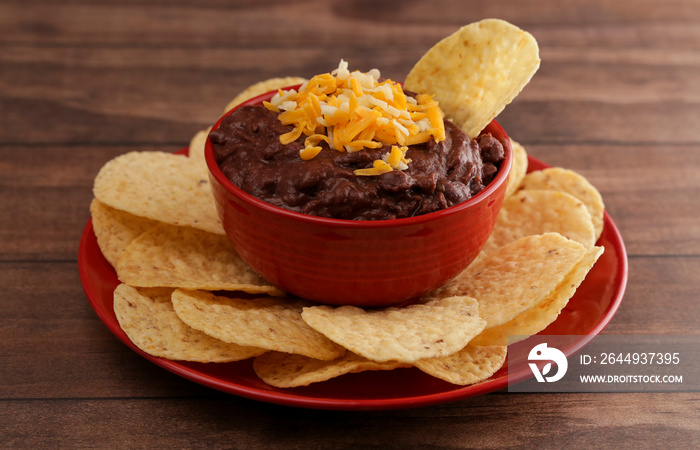 Bowl of Black Bean Dip on a Wooden Table