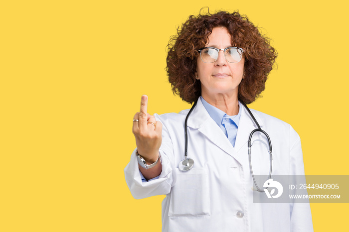 Middle ager senior doctor woman over isolated background Showing middle finger, impolite and rude fuck off expression