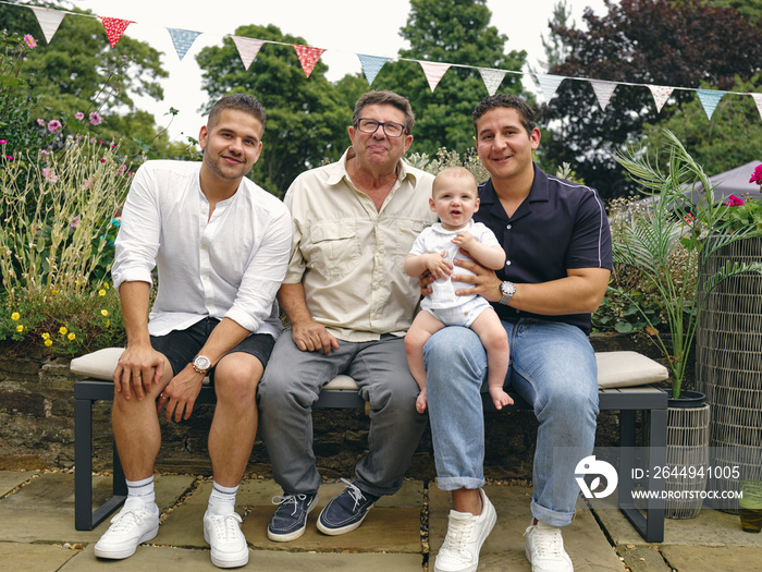 Portrait of father with sons and grandson