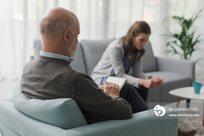 Depressed woman talking during a therapy session