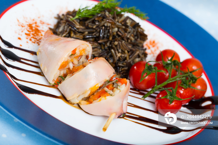 Appetizing squid stuffed with bell pepper, egg, wild rice and greens