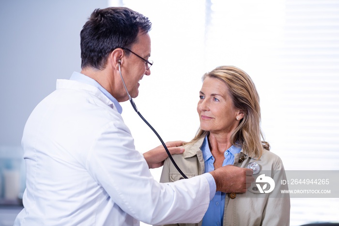 Doctor examining a female patient