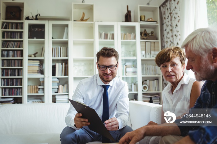 Senior couple planning their investments with financial advisor