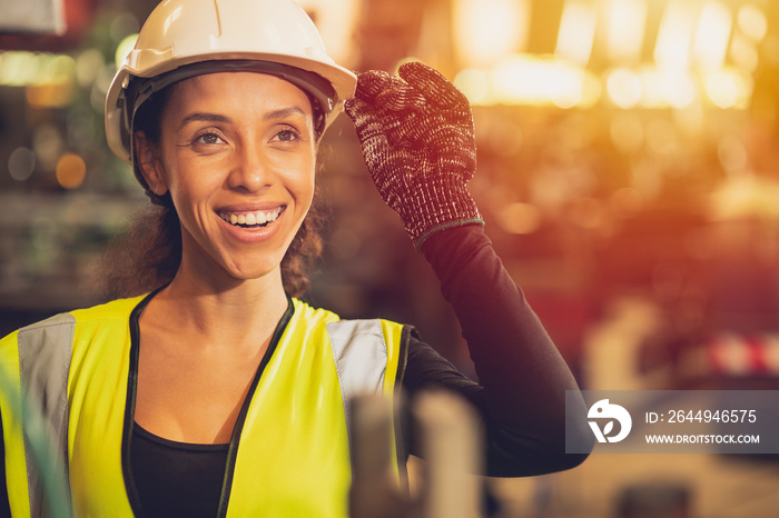 African American woman happy worker engineering working smile labor in heavy industry factory with good welfare concept.