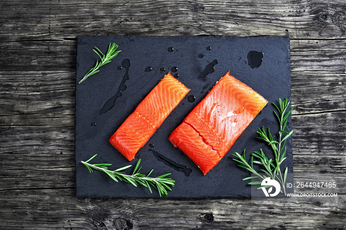 salmon fillet with fresh rosemary and drops of olive oil