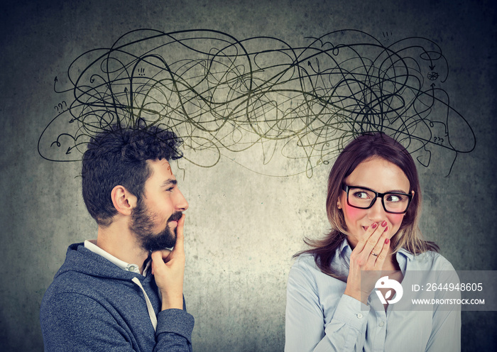 bashful woman looking at a handsome man both exchanging with each other with many thoughts