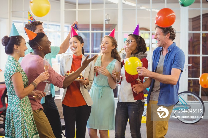 Business people celebrating a birthday