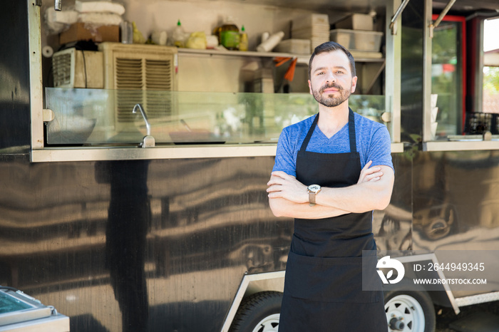 Male cook with a food truck