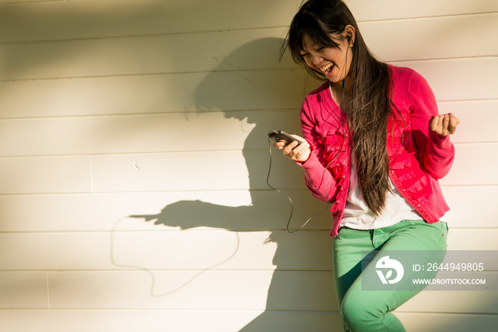 Woman listening to mp3 player