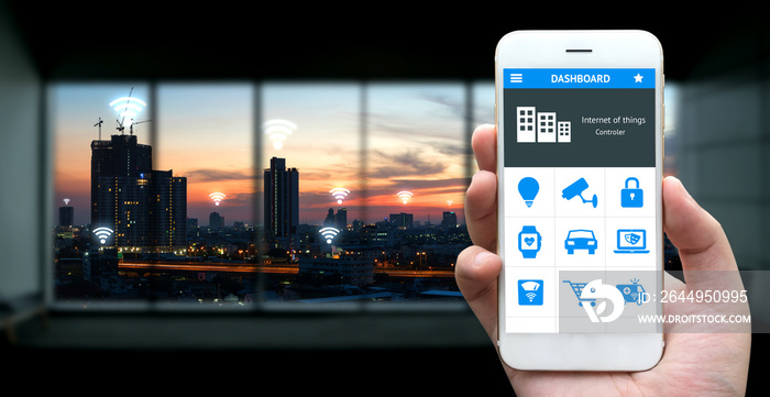 Internet of things , iot , smart home , smart city and network connect concept. Human hand holding white phone and application with city sunset view background and wifi icons inside building