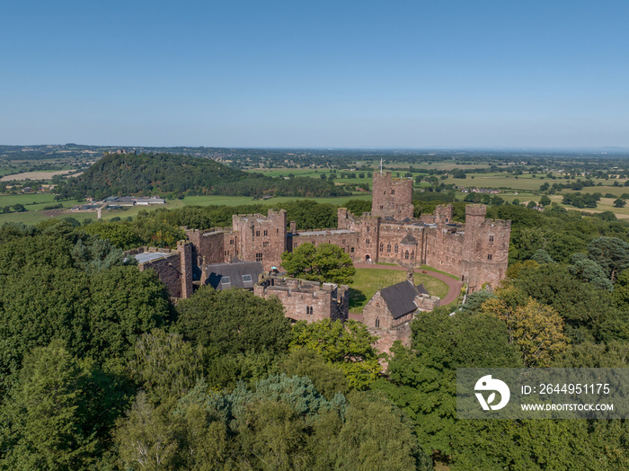 Peckforton Castle Cheshire, historic castle in rural Cheshire north west England, United Kingdom. Aerial view of the castle and wedding venue by drone