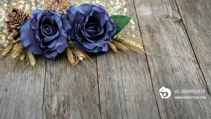 DEEPEST SYMPATHY CARD WITH PURPLE ROSES FLORAL ARRANGEMENT ISOLATED ON OLD WOODEN BACKGROUND. MEMORIAL AND CONDOLENCES ON DECEASES. ALL SOULS DAY. COPY SPACE.