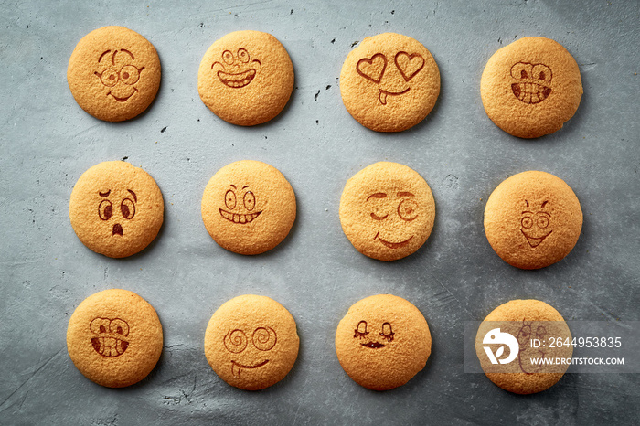 set of round cookies with different emotions, faces with emotions