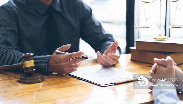 Businessman and lawyer discuss the contract document. Treaty of the law. Sign a contract business. lawyer concept.