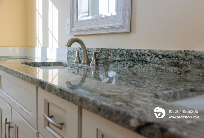 Modern grey marble countertop designer bathroom with sinks bathtub