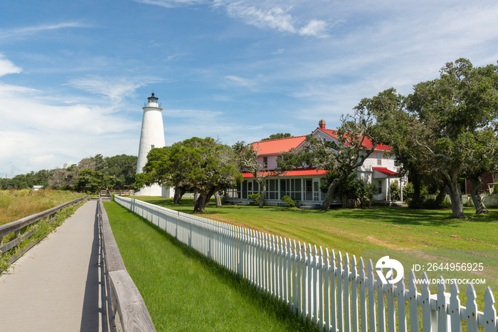 old white lighthouse and red roofed lighthouse keeper’s home on Ocracoke Island, North Carolina