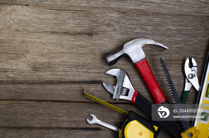 Tools on  wooden background.