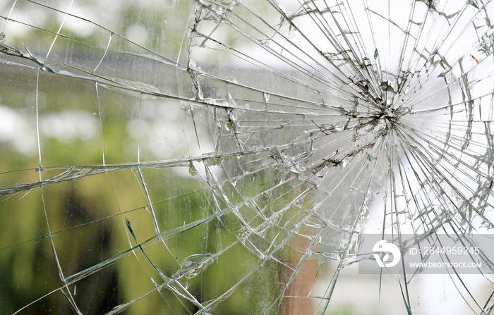 Old cracked dirty broken glass window background.