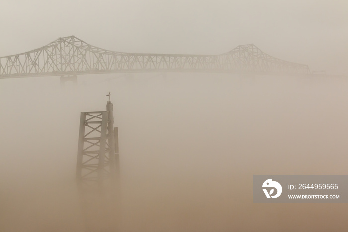 Fog Shrouded Steel Bridge Seen From The Mississippi River Park, Baton Rouge, Louisiana, USA