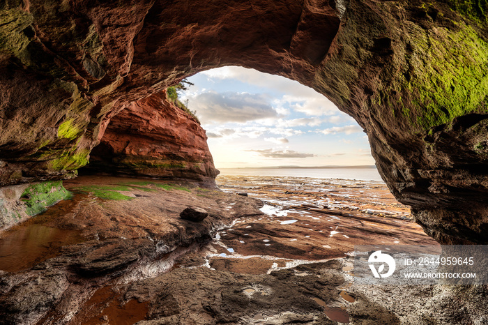 View looking out from a cave during low tide at Burncoat Head, site of highest recorded tides located in Nova Scotia, Canada