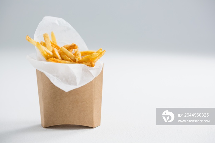 Close up of French fries in paper bag