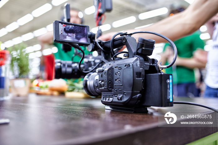 Behind the scenes of video production or video shooting. The concept of production of video content for TV, blog, shows, movies. Cameras prepared for video filming