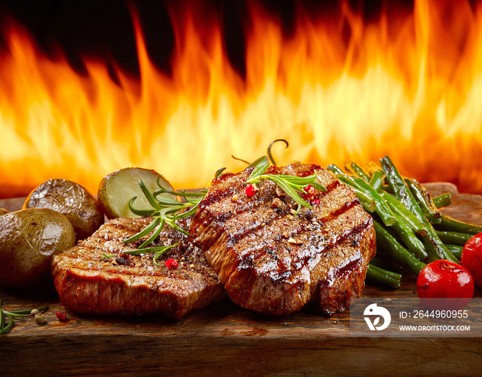 freshly grilled steaks and vegetables