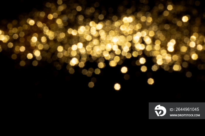 Golden blurred bokeh lights on black background. Glitter sparkle stars for celebrate. Overlay for your design