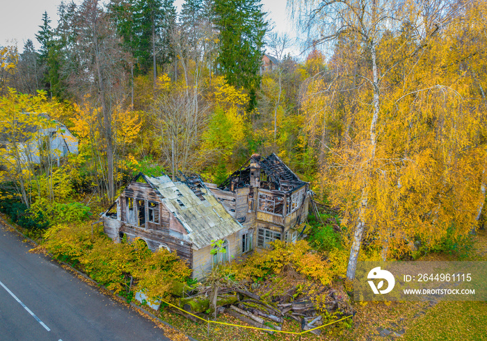 Aerial photo of the ruins of a burnt wooden house after fire