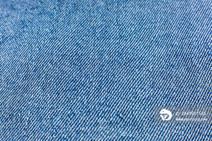 Blue hipster jeans material. Denim Cloth texture background. Natural fabrics textile.