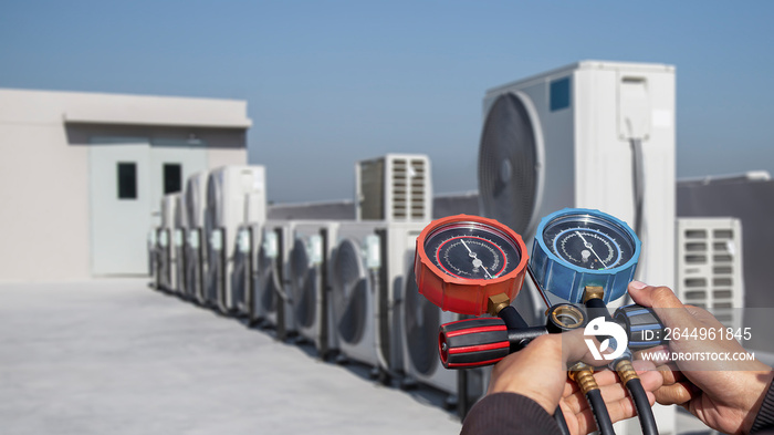 Air conditioner technician checks the operation of industrial air conditioners.