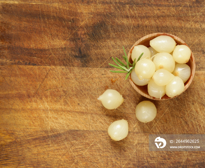 marinated pearl onions in a wooden bowl