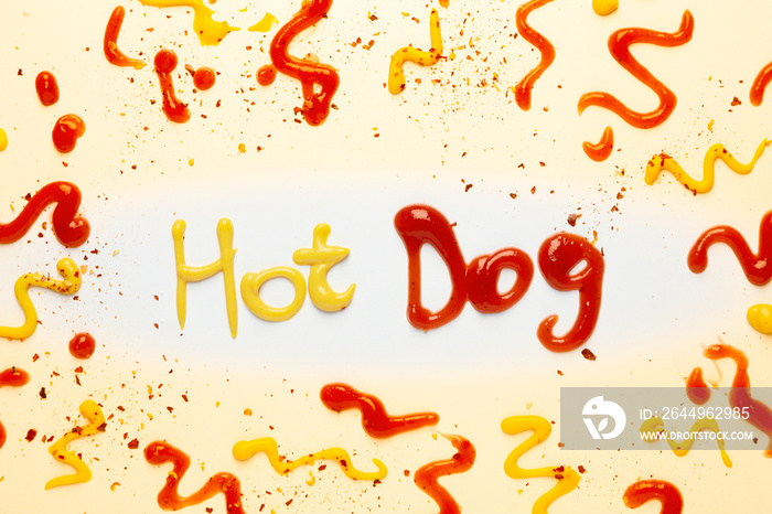 Inscription Hot dog made of sauces and spices on white background