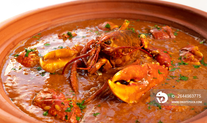 Lobster stew in a clay pot dish. Caldereta de bogavante