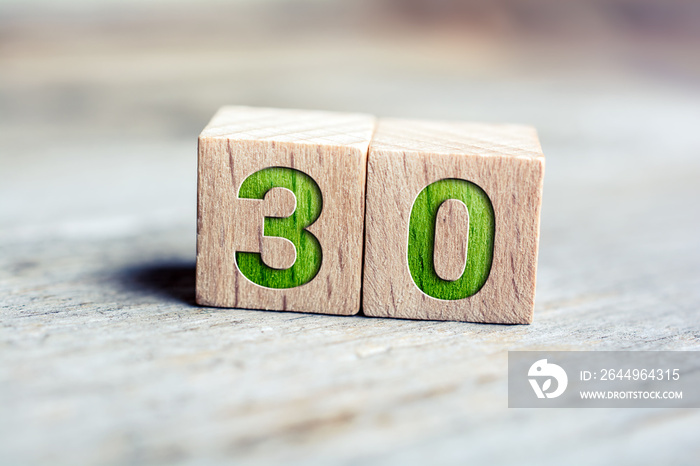 Number 30 Formed By Wooden Blocks On A Board