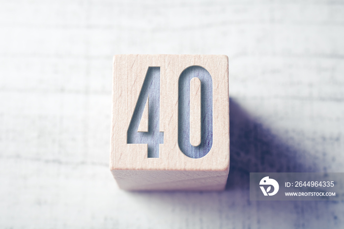 Number 40 On A Wooden Block On A Table