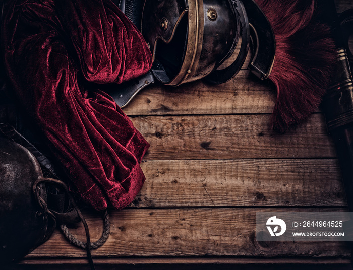 Complete combat equipment of the ancient Greek warrior on a wooden boards.