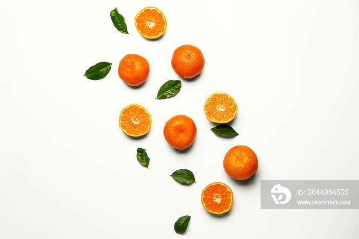 Sweet tangerines on white background