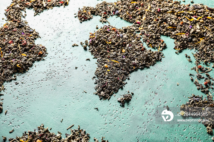 World map made of green tea on color background