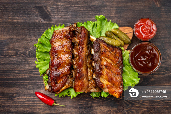 Grilled ribs with barbecue sauce and ketchup