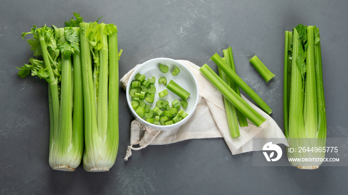 Fresh green organic celery. Celery chopped and celery stalks. Top view, flat lay